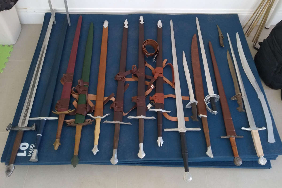 A collection of stage swords at a stage combat workshop